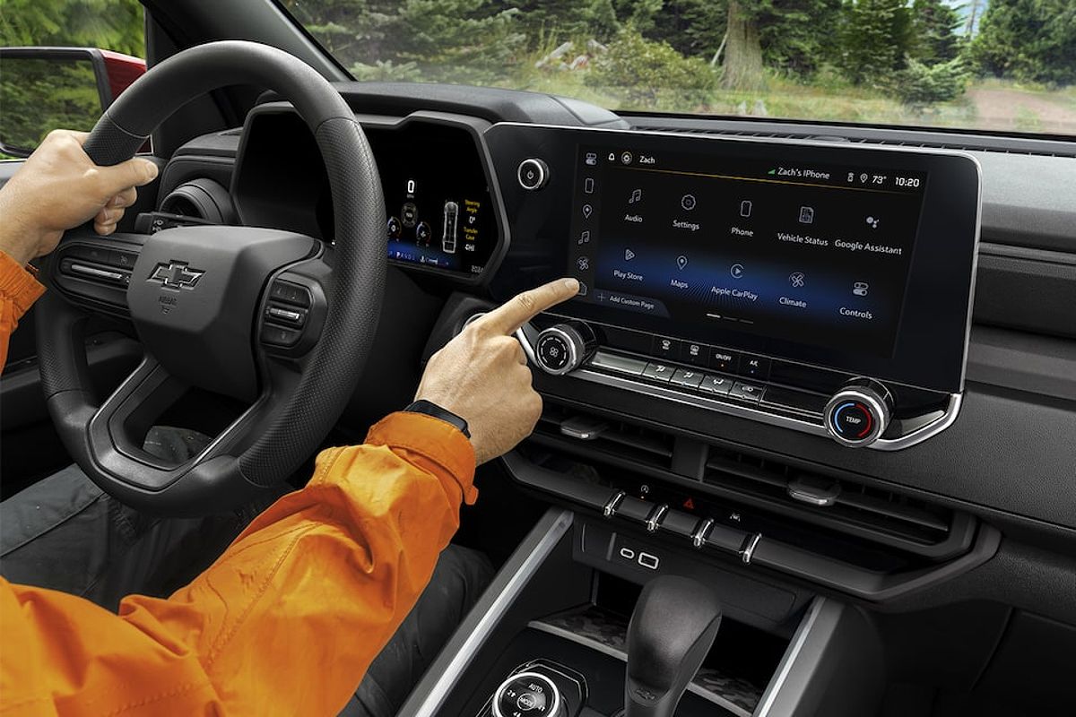 Close up of a Driver Using the Digital Instrument Cluster in the Chevy Colorado