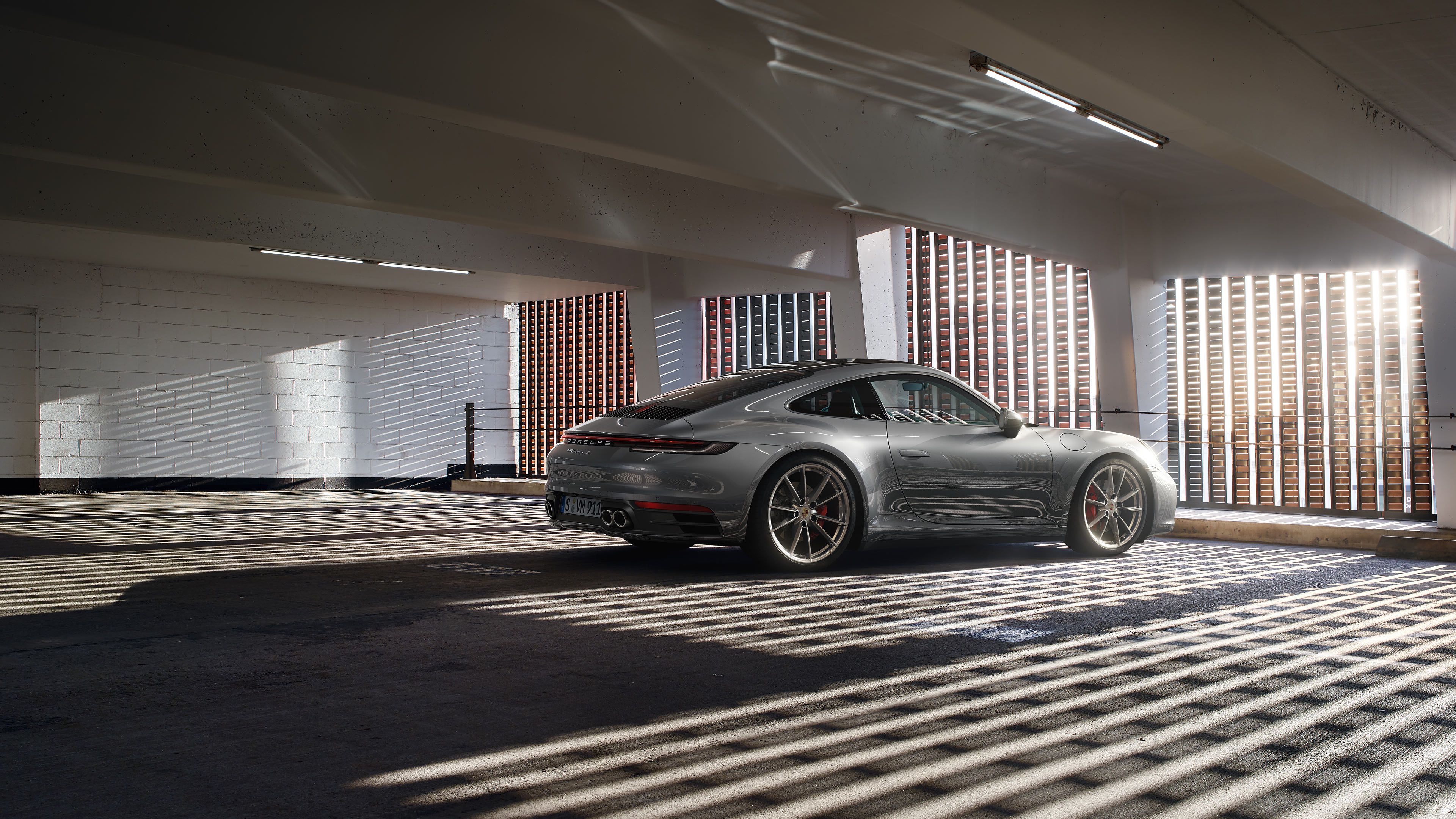 Porsche - The harmony of tradition and modernity—the iconic flyline and the continuous light strip.